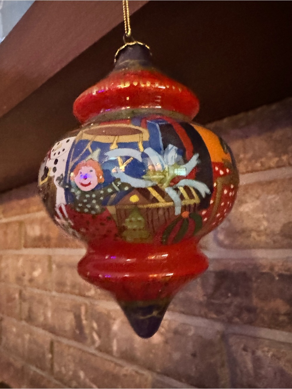 Hand-Painted Red Holiday Ornament with Festive Scene